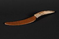 Replica of a knife with a copper blade and a handle made from caribou antler.