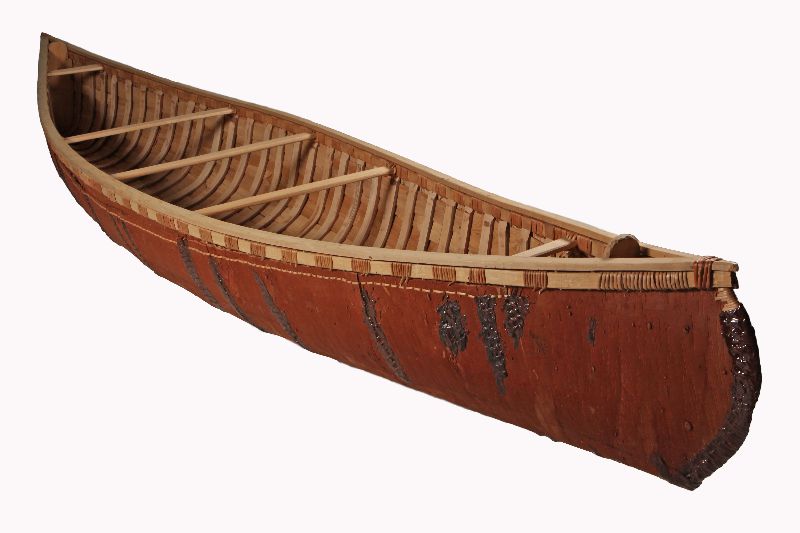 A birch bark canoe with a wooden frame. Traces of fir resin are visible.